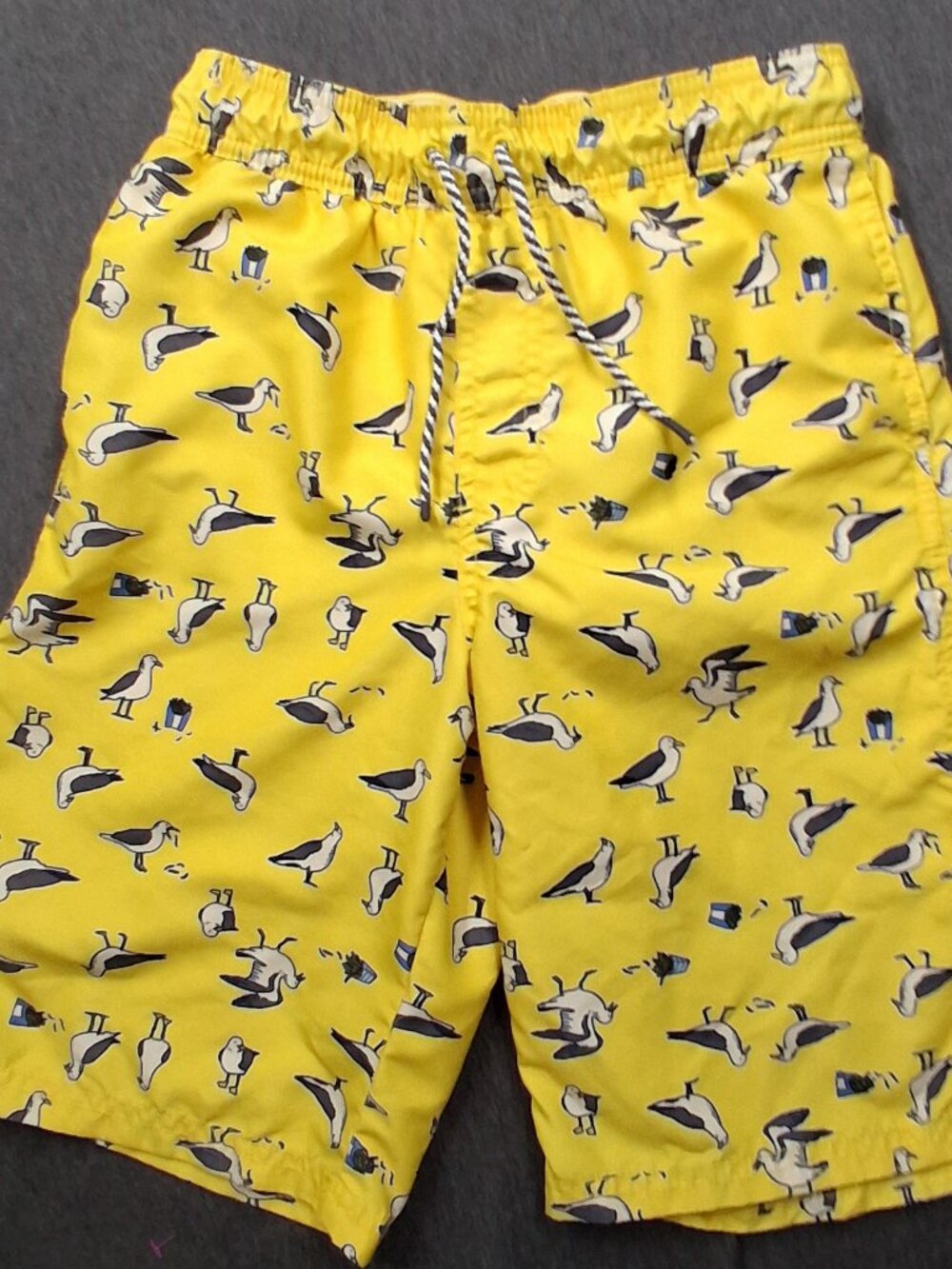 Cat and Jack boys swim trunks size 16 yellow and black Good condition